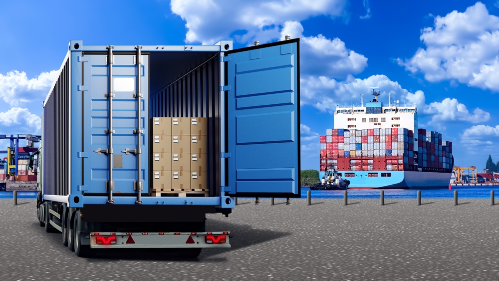 A cargo truck and container ship at a port in summer, illustrating our guide on freight tips for seasonal shipping during summer.