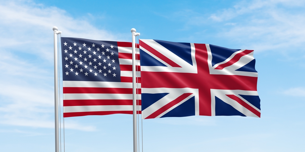 United States and United Kingdom flags flying together, representing new trade deal.