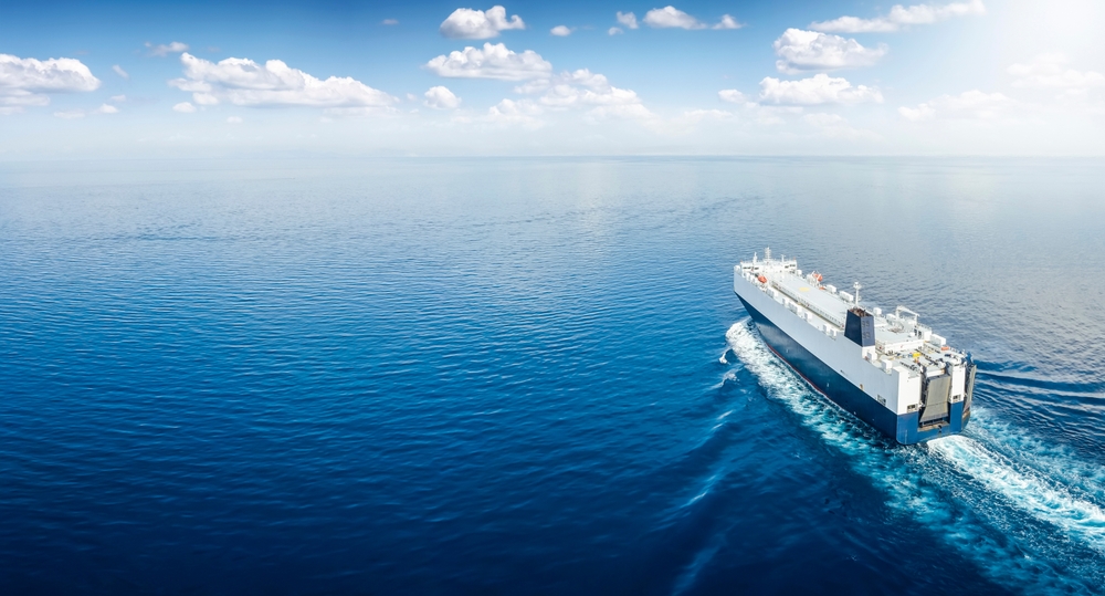 Aerial view of a big car carrier ship RoRo (Roll-on Roll-off) cruising.